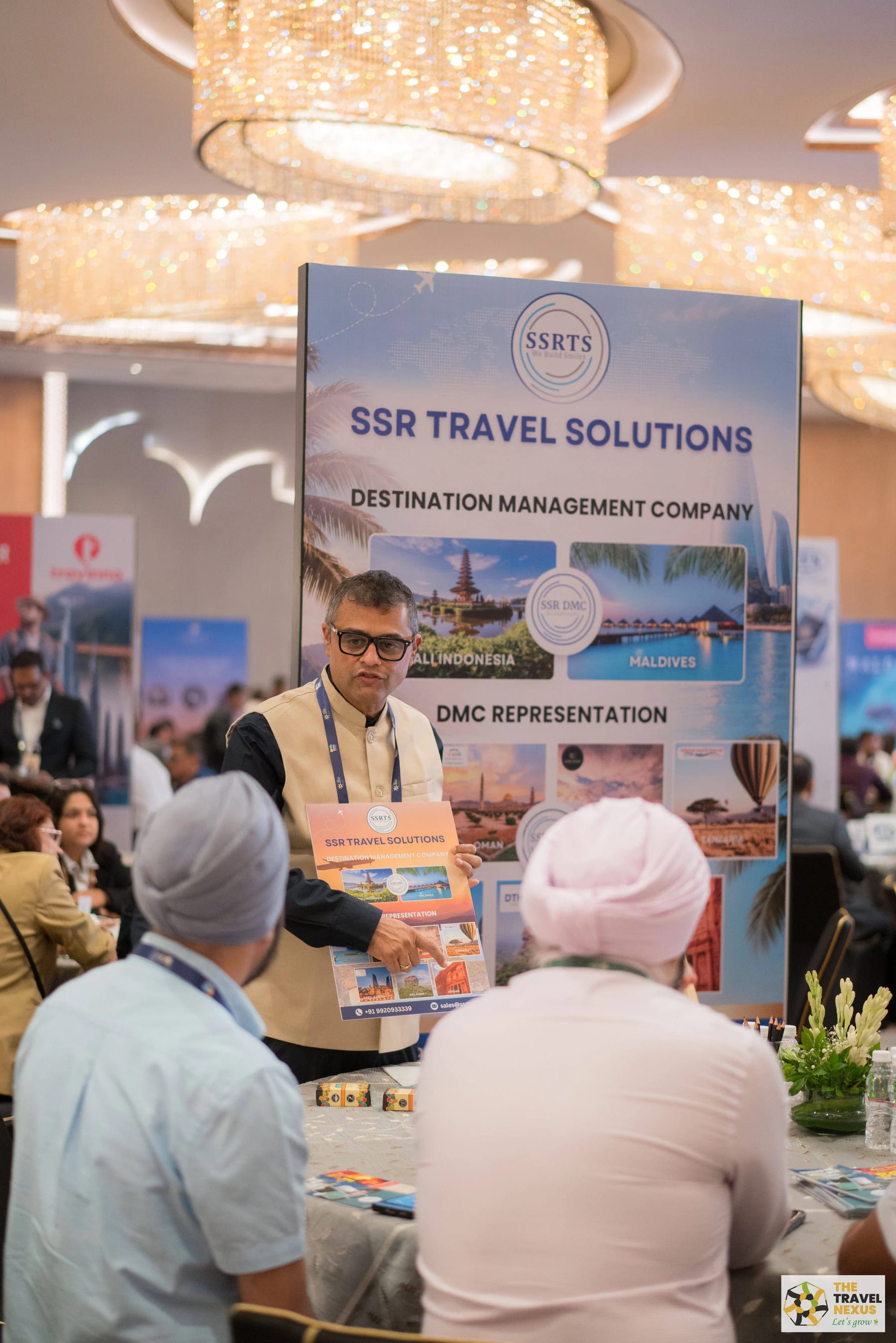 An SSR Travel Solutions representative presenting destination services to Travel Nexus members